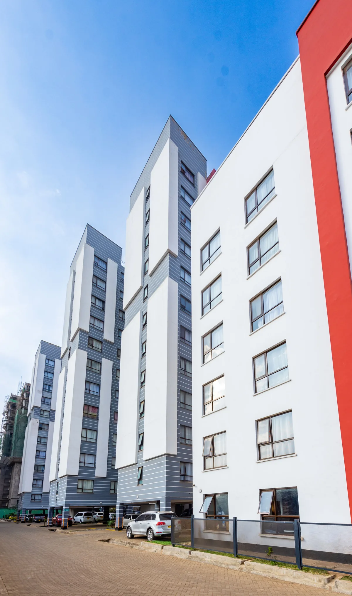 Aluminium-framed windows across a six-storey residential block in Nairobi