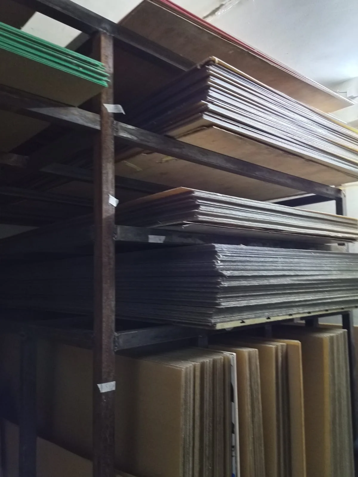 Glass sheets racked by thickness and tint in the EGZ workshop