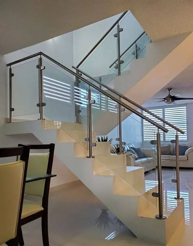 Glass and stainless balustrade to a split-level staircase and landing